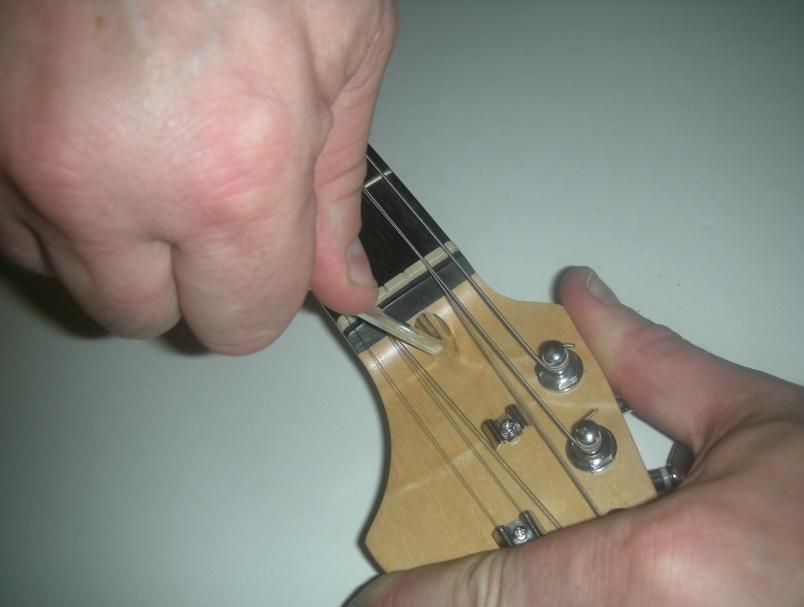 over-tighten the truss rod. Sighting along the neck should show a very slight concave tendency this is called relief and too straight a neck may lead to fret buzzing.