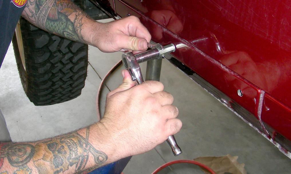 Use an open end wrench to hold the coupler nut stationary while turning the head of the bolt clockwise with a ratchet (or small impact wrench) and socket.