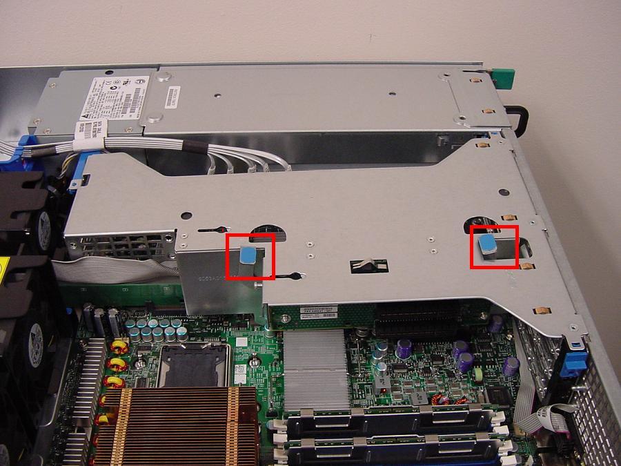 3. Gently lift both locking handles to remove the PCI riser