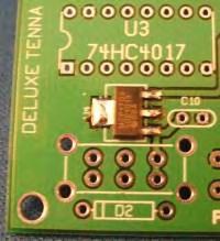 the lead over the pad which you just tinned. Then heat and flow a little solder to all of the leads of the part.