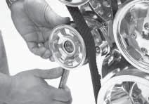 B] Place a 5/8 box end wrench on tensioner, align belt onto grove