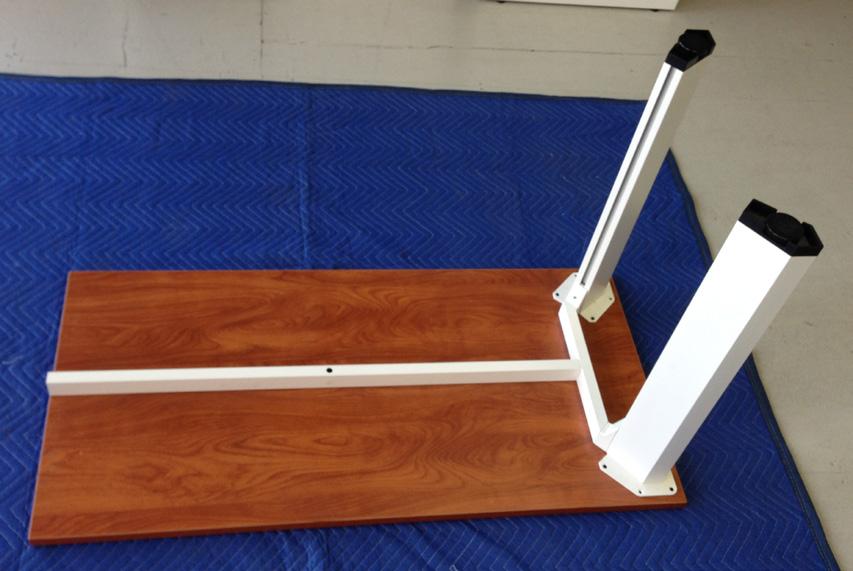 sized to run along the depth of the tabletop. 4. On the opposite end of the support beam, slide on a freestanding leg with beam bracket secured.