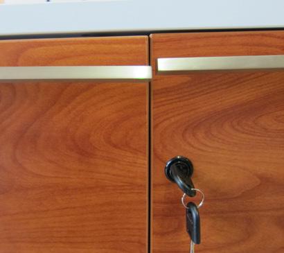 Place the handle over the predrilled holes at the bottom of the door.