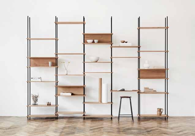 SYSTEM SHELVING b y M O E B E SHELVING SYSTEM is simple both in aesthetics and construction. The fine lines and clever construction give this piece of furniture its refined look.