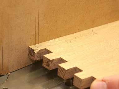 To make the final cuts, I positioned each workpiece on the router table, top against the fence and inside face down, and lifted the leading edge to keep it from contacting the bit. Fig. 2.
