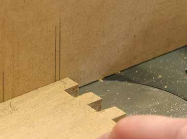 2 Grooves also are required in the box sides to accept the drawer runners. I made these at the router table, using a 1/4" spiral upcut bit with the fence set back 1 15 16".