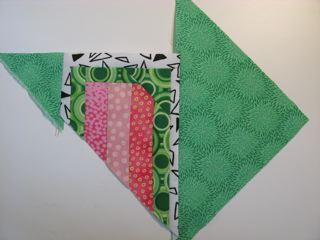 Photo 4A Heart background fabric attachment Next, sew the bias side of the other 8½" triangle across the fabric edge