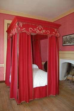 canopy bed is similar to a four-poster bed with posts at each of the four corners extending four feet high or more above