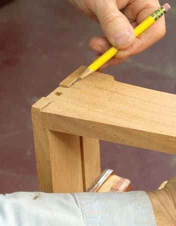 For better control, glue one finger joint at a time, being careful to keep things square. Drill and install the dowel pins that secure the joints. Then glue in the drawer back.