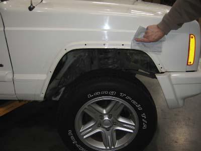 metal fender with a damp cloth and dry.