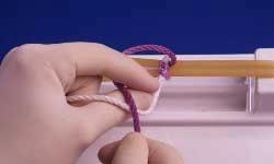 Surgeon's or Friction Knot Page 3 of 3 9 With thumb swung under white strand, purple