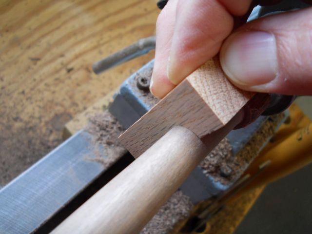 Checking tenon diameter on stretcher end: Carefully cut the stretchers to exact length, keeping them in the correct locations since they will all be different lengths.