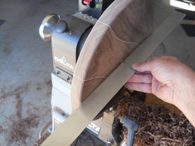 The seat blank is sanded to remove all of the remaining lathe marks