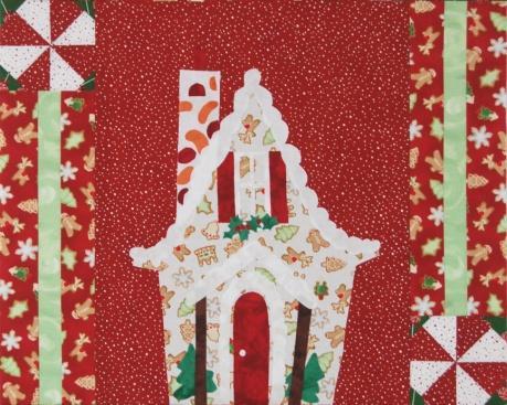 Sew each side of the appliqué unit as shown. Press to the appliqué unit. (Note: Be careful to place pinwheel/snowball blocks as shown) 14.