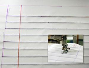 Now we re ready to sew our notebook lines with colored thread. First, sew the horizontal lines with blue thread. Then, sew the one vertical line with red thread.