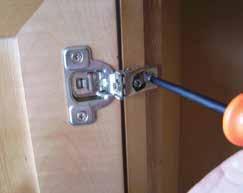 Unscrew the hinge plate screws half a turn, on both hinge plates, to raise or lower the door. 2.
