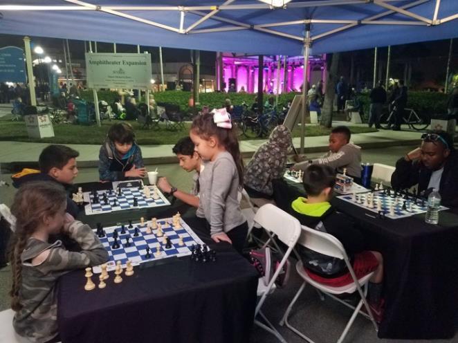 The pictures below show Sunrise Police Officer Zide and Sgt. Allen playing chess at Mayors Chess Challenge events.