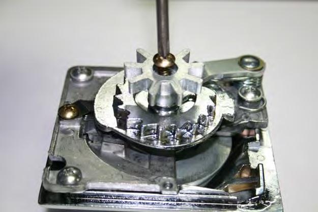 Step 13: Slide the Coin Mechanism back onto the