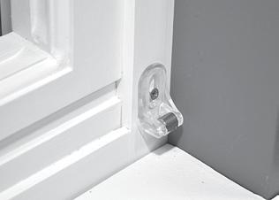 RODCT INORMATION MANA Attach the Magnetic Hold-Down Brackets (Optional) Lower the shade until it is fully lowered and rotated toward the window.