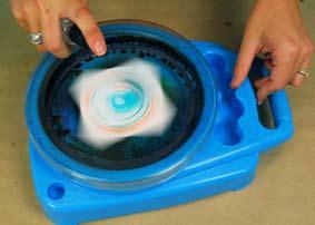 Turn spinner machine on and spray once with water this will act as the
