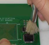 Figure 9: Board cleaned with handheld brush. The components were wetted, and then the brush was wetted and used to scrub the contaminated area.