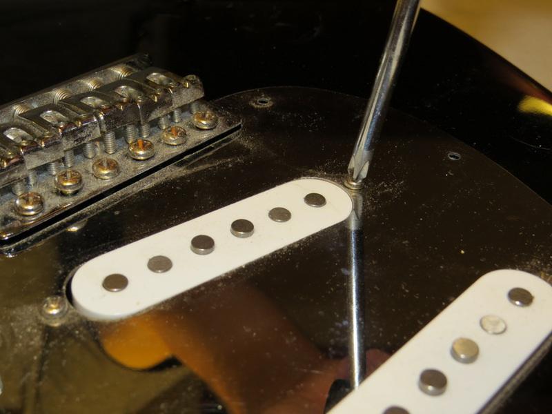 Step 9 Remove the screws from the pickups.