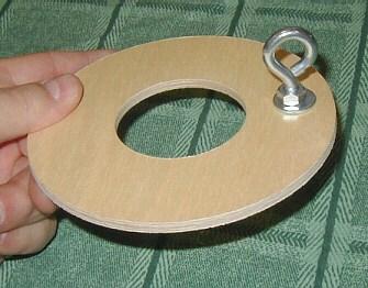 Use a hammer to pound the T- nut flush with the centering ring.
