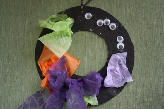 Halloween Tissue Paper Wreath Paper plates Black, orange, purple and green tissue paper Wiggle eyes Black paint Scissors Glue Hole punch Yarn Cut the center out of each paper plate create a wreath