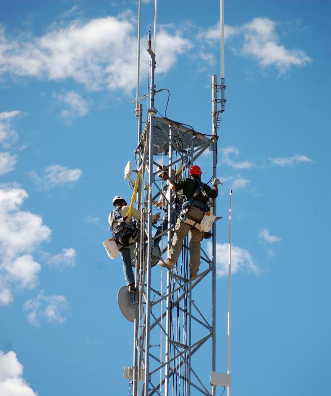 Figure 4. Working on a tower during deployment of the wireless network. Photo courtesy of Valley Communications Association. 2018. All rights reserved.