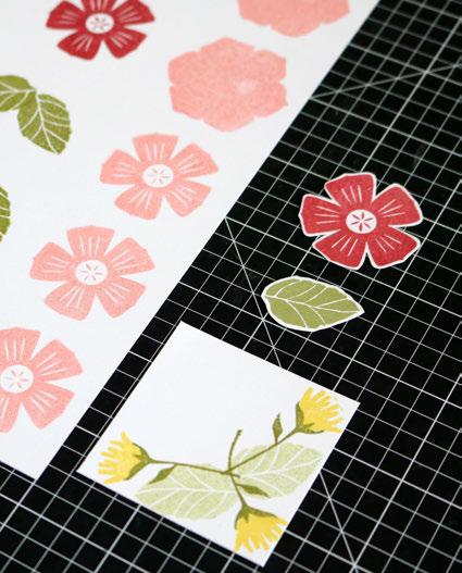 3) Stamp the flower overlay in Pomegranate (qty. 2) Stamp the leaves in Fern as shown (qty. 5 in pairs and 1 single) Cut the Zip Strips off of each piece of paper before cutting project pieces.