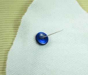 Step 3: Sew on the eyes: (A) Insert the needle