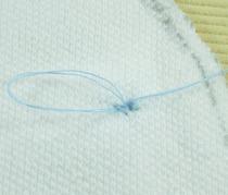 closest stitch to where the needle came out.