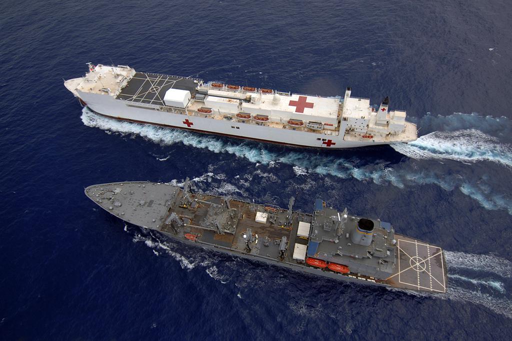 order to achieve shipboard landing. Figure 4. USNS Mercy (T-AH-19) and USNS Pecos (T-AO 197) demonstrate various configurations for helicopter landing deck placement. Official U.S. Navy photograph by Chief Photographer s Mate E.