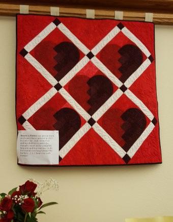 She will have two previous Best of Show quilts for the guild to see.