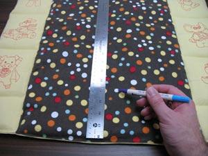 To quilt the center panel, measure and mark the center point of the top and bottom edges.