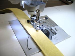 Sew a seam along both sides of the long edges on each side of the strap.