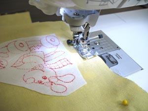Then, align the embroidered side panels on each side of the flannel piece with the