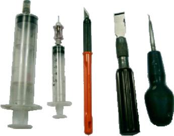 A rubber-nozzle filling syringe, a short needle priming syringe, a beveled side and chisel type cutting tool