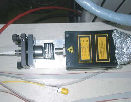 Timing and cross-talk properties of BURLE multi-channel MCP PMTs Figure : Apparatus for the measurement of single photons with the MCP-PMT. Left photo: Laser unit with filter and light guide.