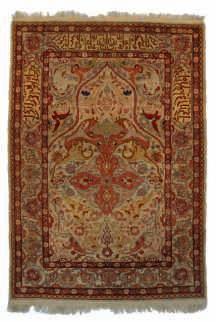 with gilt thread, 22,5 x 32,5 cm An Oriental rug, decorated