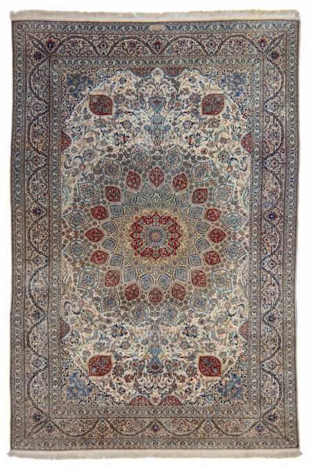 LOT 621 An Oriental rug with stylized floral motifs,