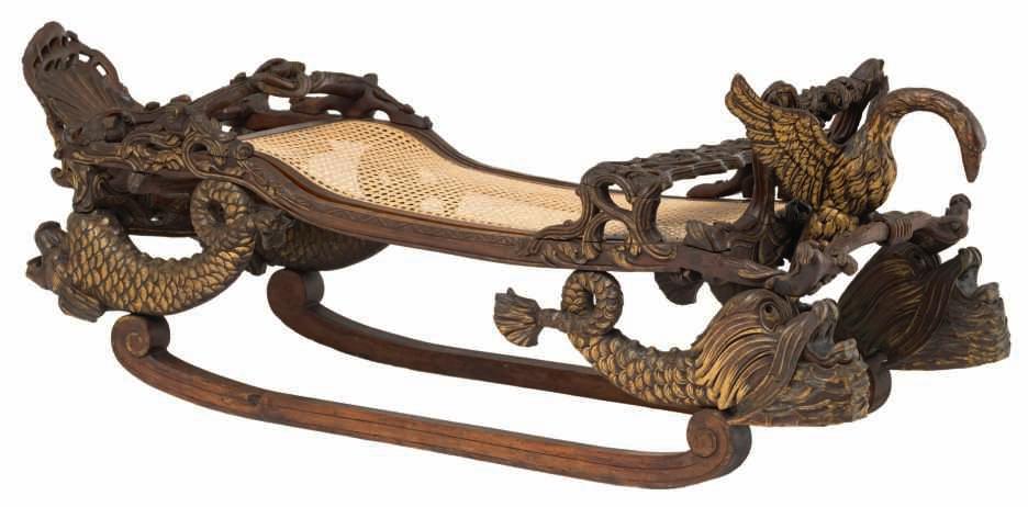 155 LOT 754 A rare 19thC stained and gilt pine / walnut sledge, richly