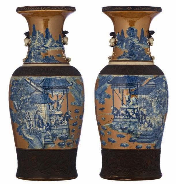 46 LOT 229 A fine pair of Chinese brownish ground blue and white stoneware vases, overall decorated with figures
