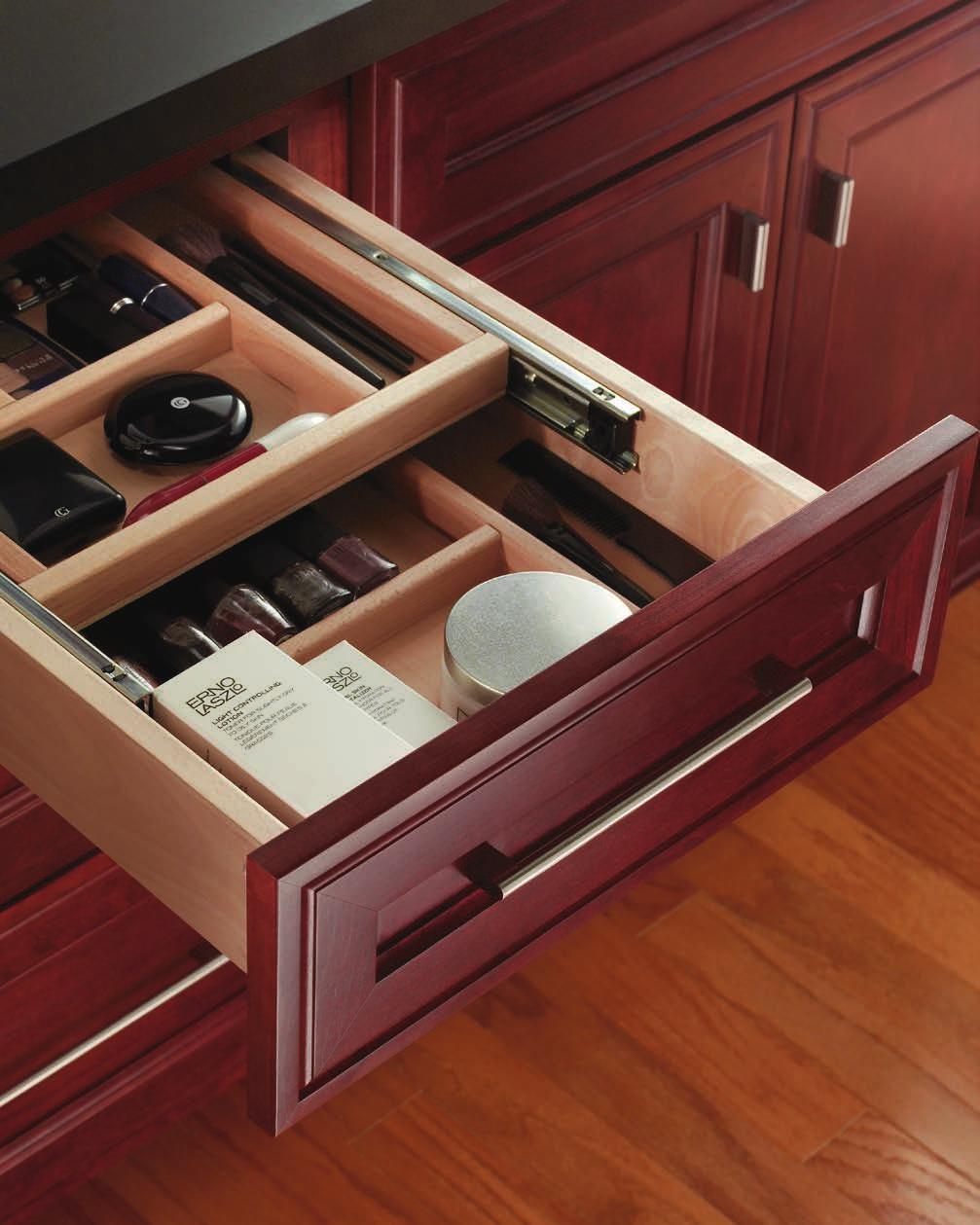 Cabinetry features doors with reversed raised center panels and five-piece mitered drawer front