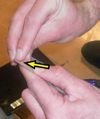 6. Peel off the adhesive patch from the RPM sensor magnet mount