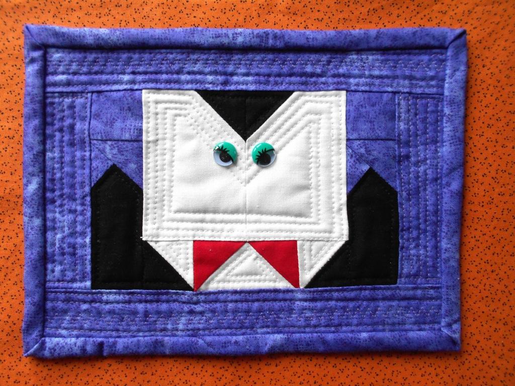 Spooky Scary Mug Rug Count Dracula Designed by Sandra Dennison @ graybarndesigns.com From matching white scraps for face, cut: (2) 3.5 x 2.5 rectangles (2) 1.5 x 1.