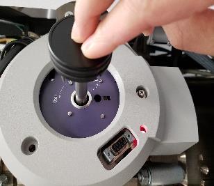 Slowly and smoothly rotate the holder Counterclockwise to its stop position and let it gently into the microscope column area (Octagon: < 20 Log) 4.