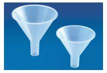 Used in conjunction with a filtering flask to filter mixtures of solids and