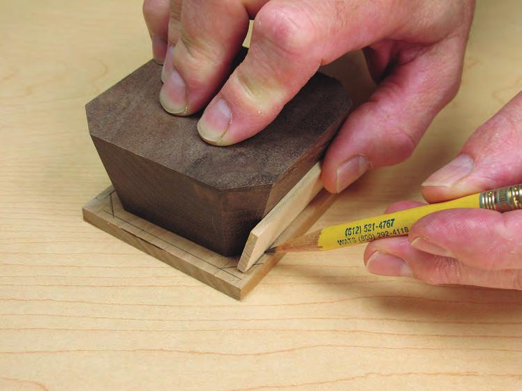 Use a /8 -thick spacer to define the desired overhang and shape of the lid. Join the handle to the lid with /8 -diameter dowel pins. They re small, but they do the job.