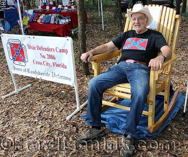 Harvey Resnick sits in the big wooden rocking chair he built.